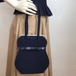 Fabulous vintage Anya Hindmarch frame bag with curvy waist line and bow